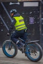 OSLO, NORWAY - MARCH, 26, 2018: Outdoor view of police man riding a bycicle in the sreets of Oslo city Royalty Free Stock Photo