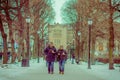 OSLO, NORWAY - MARCH 8, 2017: Outdoor view of unidentified couple inlove in Vigeland Park on a breezy winter day
