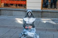 Oslo, Norway-may 26: an unknown MIME in a Silver suit performs on a street in Oslo on July 11, 2013 . Living statues entertaining Royalty Free Stock Photo