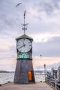 Oslo, Norway - Modernistic Aker Brygge district of Oslo with historic Clock Tower at the pier of Oslofjorden shore Royalty Free Stock Photo
