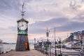 Oslo, Norway - Modernistic Aker Brygge district of Oslo with historic Clock Tower at the pier of Oslofjorden shore