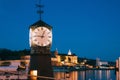 Oslo. Norway. Old Clock at Aker Brygge In Oslo Embankment, Norway. Night View Of Famous And Popular Place.Oslo. Norway Royalty Free Stock Photo