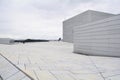 Oslo, Norway, September 2022: Exterior view of the modern Oslo Opera House building, with people walking on the roof. Royalty Free Stock Photo