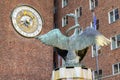 Oslo, Norway - Swan fountain sculpture by Dyre Vaa in front of City Hall historic building - Radhuset - with astronomic tower