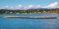 Oslo, Ostlandet / Norway - 2019/09/02: Panoramic view of Oslofjord harbor with Cormorant sea birds resting on a rock with Bigdoy Royalty Free Stock Photo