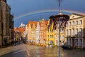 OsnabrÃÂ¼ck, Lower Saxony, Germany, June 5, 2021. Rainbow over St. Marien church and facedes of old houses on the Market square in Royalty Free Stock Photo