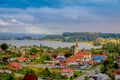 OSORNO, CHILE, SEPTEMBER, 23, 2018: Above view of the church on the background of the river, Puerto Octay