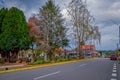 OSORNO, CHILE, SEPTEMBER, 23, 2018: Outdoor view of park of dowtown with some trees in a cloudy day with some cars