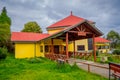 OSORNO, CHILE, SEPTEMBER, 23, 2018: Outdoor view of wooden building with red rooftop and yellow walls of terminal