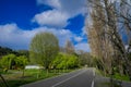 OSORNO, CHILE, SEPTEMBER, 23, 2018: Outdoor view of wooden cottage buildings located at one side of the road surrounded