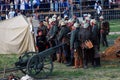 Osovets battle reenactment. Soldiers gathered by a cannon.