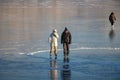 Osoyoos, British Columbia, Canada - December 31, 2021: Skaters on a frozen lake in winter Royalty Free Stock Photo