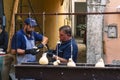 Vendors prepare caciocavallo cheese, called Impiccato, at the festival, in Ospedaletto d\'Alpinolo near Avellino, Italy