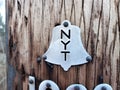 Old fashioned New York Telephone company metal badge on pole