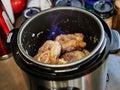 Ossobuco with spindle Beef is roasted in a pressure cooker with fire. French gourmet cuisine Royalty Free Stock Photo