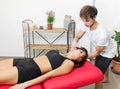 Osteopath performing cervical trust on a woman Royalty Free Stock Photo