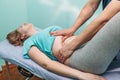 Osteopathic belly massage young woman