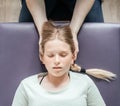 Ostheopatic treatment of a girl patient using CST gentle hands-on technique, central nervous system tension relieve