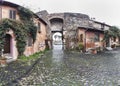 Andscape of Medieval village of Ostia Antica and the view of the ancient entrance, shooting in a cloudy winter day