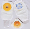 Ostomy bags, seals and cutting guide