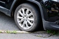 Gripmax Stature M S tyre on Jeep SUV damaged and squeezed by wrong parking on the edge of pavement