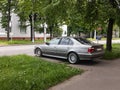 Silver BMW 5 Series E39 saloon car parked on street Royalty Free Stock Photo