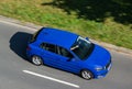 Blue Skoda Fabia IV vehicle with strong motion blur effect in top view