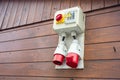 Electrical box controlling the electricity supply on a wooden cottage