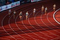 400m Female Race Amidst Light and Shadow in Track and Field Event