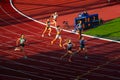 400m Female Race in Bend Showcasing Interplay of Light and Shadow in Track and Field Race for