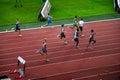 400m Men's Race Amidst Light and Shadow in Track and Field Event