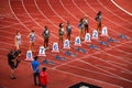 Women Sprinters Prepare for 100m Hurdles Race Commencement in Track and Field Championship for