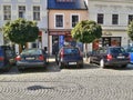 Ostrov nad Ohri, Czech republic - September 2012: old houses and parked cars on Stare Namesti square at end of summer