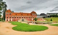 Ostrov nad Ohri, Czech republic - September 09, 2017: red historical building of Prince`s Palace with lagoon in chateau park at b