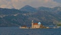 Ostrvo island and a boat visiting Our Lady of the Rocks