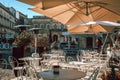 Ostuni\'s Historic Center Beautiful Piazza with Parasols Against Clear Blue Sky