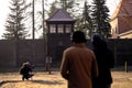 Oswiecim, Poland - January 24, 2020: A photographer taking picture of signs in Auschwitz-Birkenau Museum and Memorial