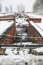 Oswiecim / Poland - 02.15.2018: Rose flowers laying on top of the gas chamber ruins Royalty Free Stock Photo