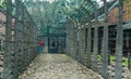 Oswiencim, Poland - September 21, 2019: tourists going trought electric fence with barbed wire at The Nazi concentration