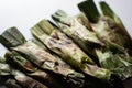 Otak-otak - Traditional food from Indonesia is a kind of snack - grilled fish cakes wrapped with banana leaf (close up) Royalty Free Stock Photo