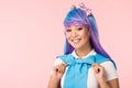 Otaku girl in purple wig looking at camera isolated on pink Royalty Free Stock Photo