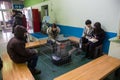 Unidentified people are sitting at heater electric area to warm body during winter cold season at Otaru, Hokkaido, Japan Royalty Free Stock Photo