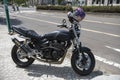 Otaru, Hokkaido, Japan - May 19, 2019: A black Japanese super bike, Kawasaki, parked on the sidewalk. Royalty Free Stock Photo