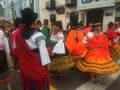 Otavalo, Ecuador: 29-6-2019: Festival with colorful indigenous woman dancing on the streets in the sierra of ecuador