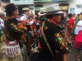 Otavalo, Ecuador: 29-6-2019: Festival with colorful indigenous man making music on the streets in the sierra of ecuador