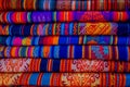 OTAVALO, ECUADOR, NOVEMBER 06, 2018: The typical andean fabrics sold on the handicrafts market of Otavalo, Ecuador