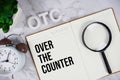 OTC - Over The Counter acronym on notepad, Business concept background Royalty Free Stock Photo