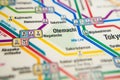 Otemachi Tokyo metro station on a printed paris metro map under a magnifier lens Royalty Free Stock Photo