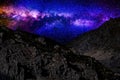 The brilliant Milky Way starry sky shining over the devastated rocky terrain. Royalty Free Stock Photo