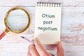Otium post negotium It is translated from Latin as, Rest after the case It is written in a clean open notebook Royalty Free Stock Photo